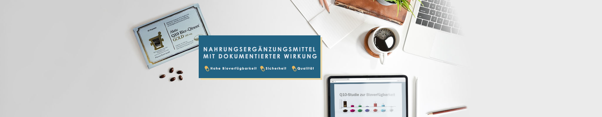 Nahrungsergänzungsmittel Laptop und Tablet Arbeitsplatz mit Q10 Schachtel